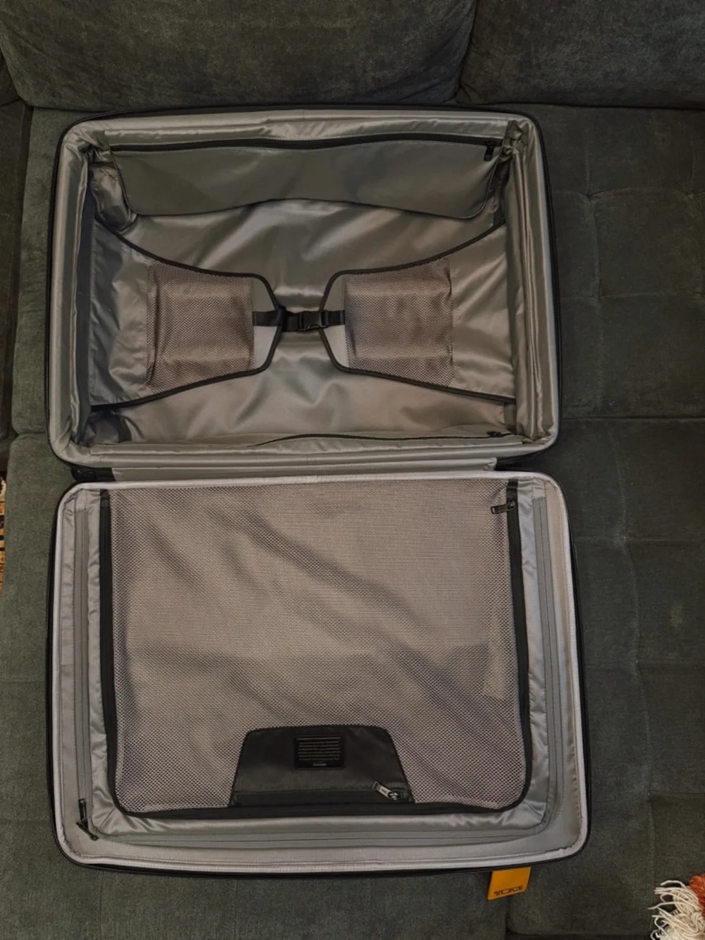 Tumi Gray Spinner Suitcase with Tan Accent Tag
